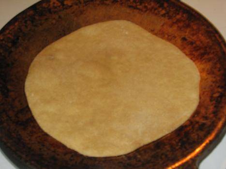 Place rolled out roti on hot tawa