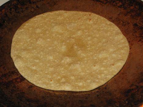 Partially fry the roti on both sides