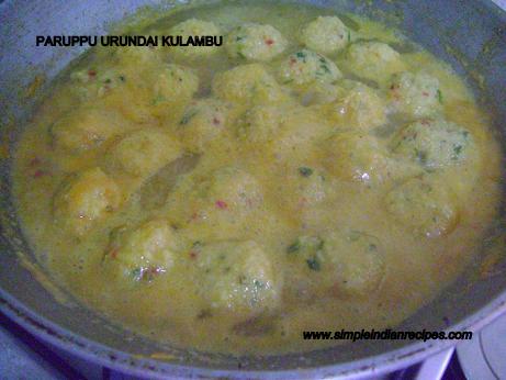 paruppu urundai kulambu - Lentil balls cooking in the gravy